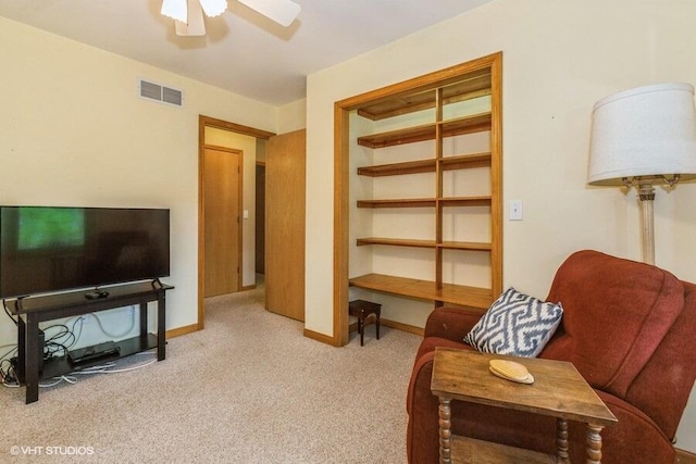 18855 Lonergan St, New Buffalo, MI 49117 - sitting room featuring ceiling fan, carpet flooring, and baseboards
