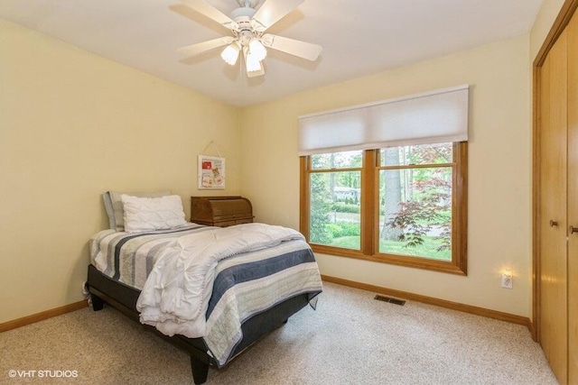 18855 Lonergan St, New Buffalo, MI 49117 - bedroom featuring light colored carpet, baseboards, a closet, and ceiling fan