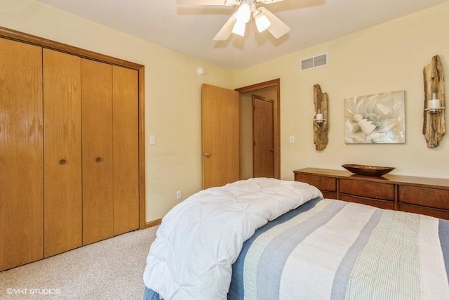 18855 Lonergan St, New Buffalo, MI 49117 - bedroom with light colored carpet, ceiling fan, and a closet