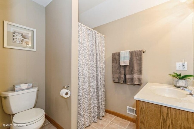 18855 Lonergan St, New Buffalo, MI 49117 - bathroom featuring toilet, baseboards, vanity, tile patterned floors, and a shower with shower curtain