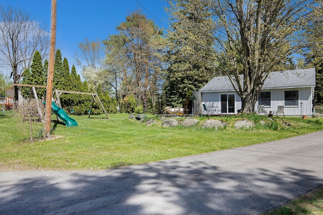 2574 S Lake Pleasant Rd, Metamora, MI 48455 - view of grassy yard featuring a playground