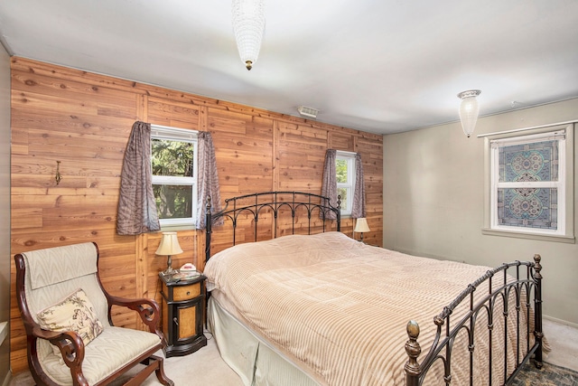 2574 S Lake Pleasant Rd, Metamora, MI 48455 - bedroom featuring carpet floors, multiple windows, and wooden walls
