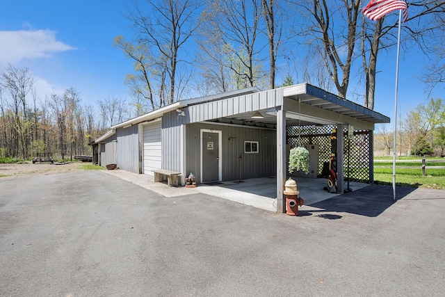 2574 S Lake Pleasant Rd, Metamora, MI 48455 - view of vehicle parking with a garage