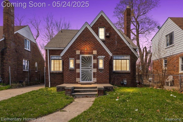 18965 Rutherford St, Detroit, MI 48235 - tudor house with brick siding and a chimney
