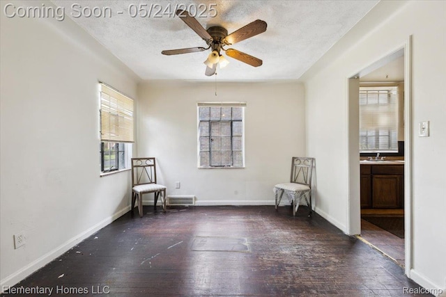 18965 Rutherford St, Detroit, MI 48235 - living area with ceiling fan, hardwood / wood-style flooring, a textured ceiling, and baseboards