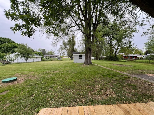 3820 Kaiser Rd, Tecumseh, MI 49286 - view of green lawn featuring an outbuilding