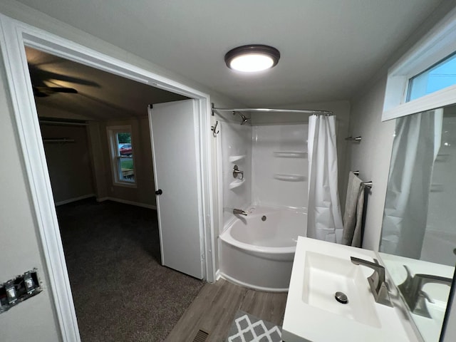3820 Kaiser Rd, Tecumseh, MI 49286 - bathroom with shower / bathtub combination with curtain, vanity, and wood finished floors