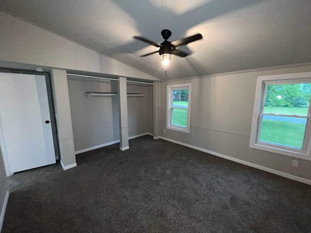 3820 Kaiser Rd, Tecumseh, MI 49286 - unfurnished bedroom featuring vaulted ceiling, dark colored carpet, baseboards, and ceiling fan