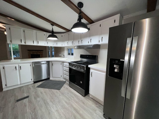 3820 Kaiser Rd, Tecumseh, MI 49286 - kitchen with stainless steel appliances, light countertops, light wood finished floors, white cabinetry, and under cabinet range hood