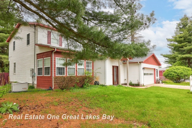 4080 Cat Lake Rd, Mayville, MI 48744 - view of front facade with a garage and driveway