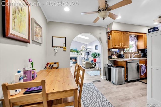 33117 Avondale St, Westland, MI 48186 - dining space featuring ceiling fan, arched walkways, light wood finished floors, and recessed lighting