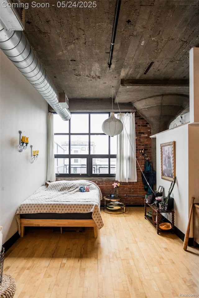 460 W Canfield St # 212/Unit 21, Detroit, MI 48201 - bedroom featuring hardwood / wood-style flooring and baseboards