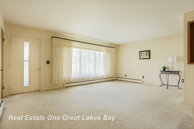 5354 N River Rd, Freeland, MI 48623 - unfurnished living room with carpet flooring and a baseboard radiator