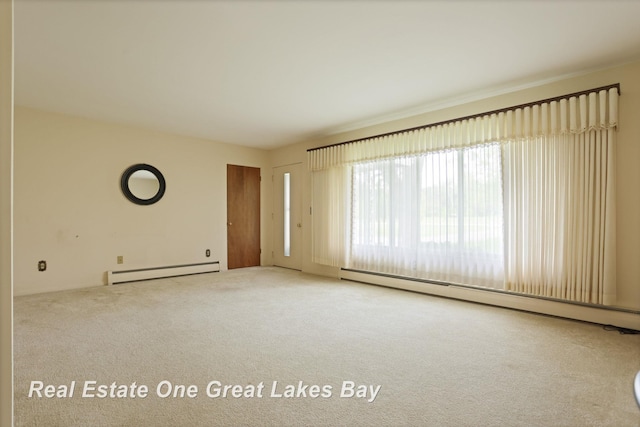 5354 N River Rd, Freeland, MI 48623 - empty room with a baseboard heating unit and carpet flooring