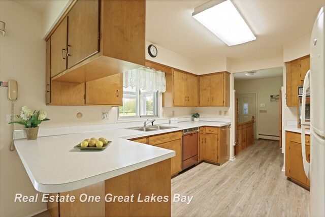 5354 N River Rd, Freeland, MI 48623 - kitchen with dishwashing machine, a sink, light countertops, a peninsula, and light wood-style floors