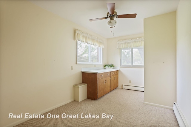 5354 N River Rd, Freeland, MI 48623 - kitchen featuring baseboard heating, light colored carpet, baseboards, and a baseboard radiator