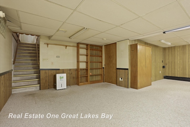 5354 N River Rd, Freeland, MI 48623 - finished basement with a drop ceiling, wood walls, stairs, carpet, and a wainscoted wall