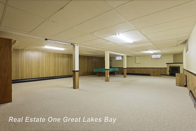 5354 N River Rd, Freeland, MI 48623 - playroom with carpet, a drop ceiling, billiards, wood walls, and a fireplace