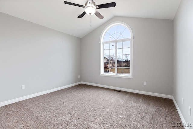 796 War Bonnet Dr, Tecumseh, MI 49286 - unfurnished room with a ceiling fan, carpet, vaulted ceiling, and baseboards