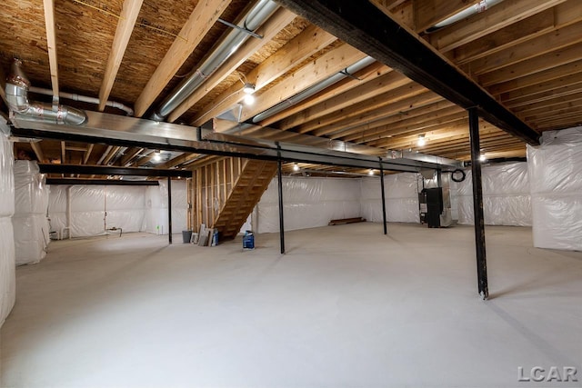 796 War Bonnet Dr, Tecumseh, MI 49286 - unfinished below grade area with stairs and heating unit