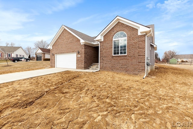 796 War Bonnet Dr, Tecumseh, MI 49286 - ranch-style house featuring brick siding, driveway, and an attached garage