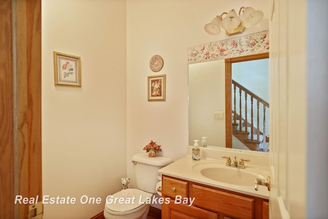 4168 Windemere Dr, Saginaw, MI 48603 - half bathroom featuring toilet and vanity