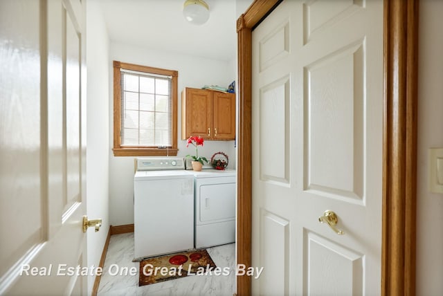4168 Windemere Dr, Saginaw, MI 48603 - laundry area with washing machine and clothes dryer, cabinet space, and baseboards