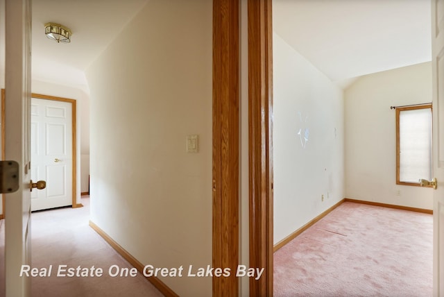 4168 Windemere Dr, Saginaw, MI 48603 - hallway featuring light colored carpet, baseboards, and vaulted ceiling