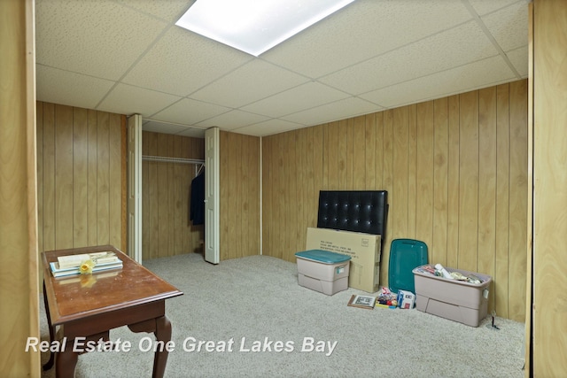 4168 Windemere Dr, Saginaw, MI 48603 - game room with carpet flooring, a paneled ceiling, and wooden walls