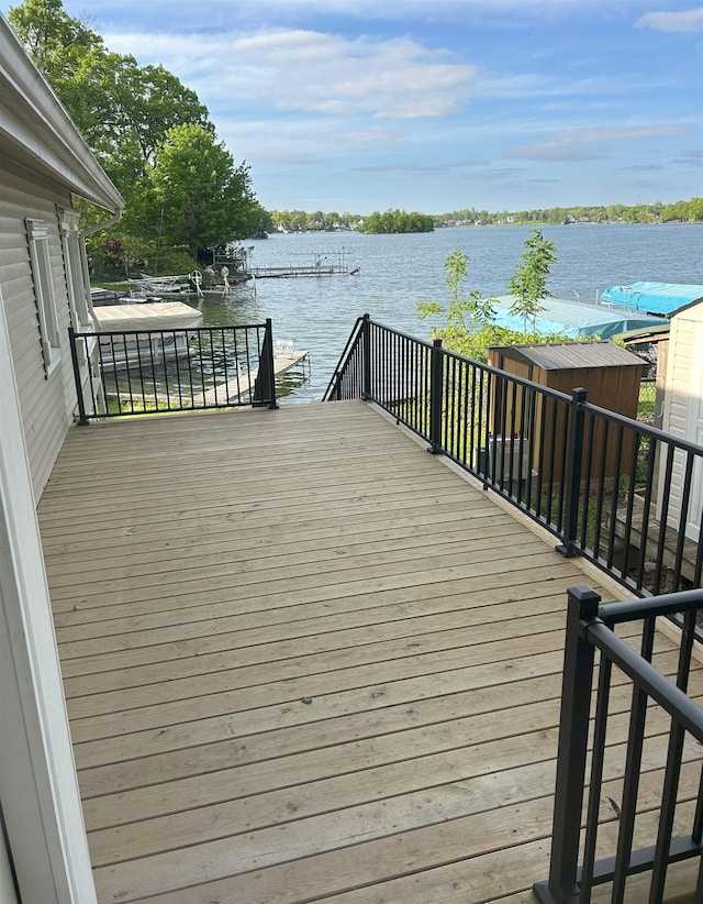 wooden deck featuring a water view