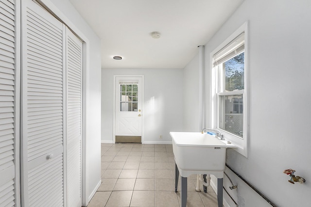 25949 Southwestern Hwy, Redford, MI 48239 - bathroom with a closet, baseboards, healthy amount of natural light, and tile patterned floors