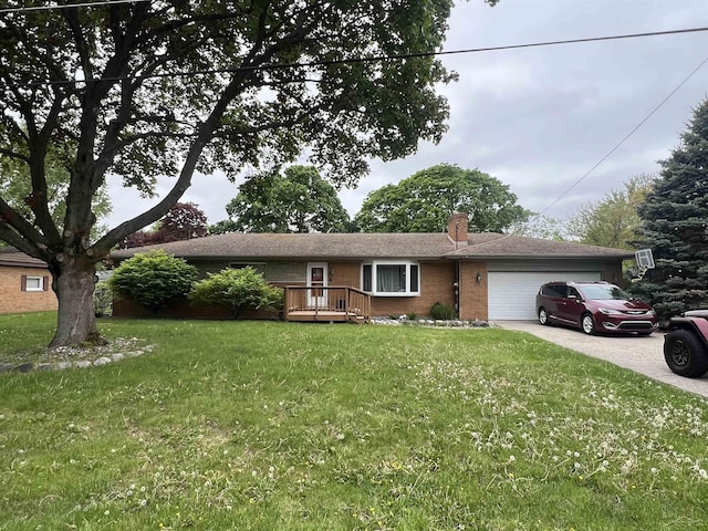 1441 Dover Pl, Saginaw, MI 48638 - ranch-style house with a garage, driveway, a chimney, brick siding, and a front yard