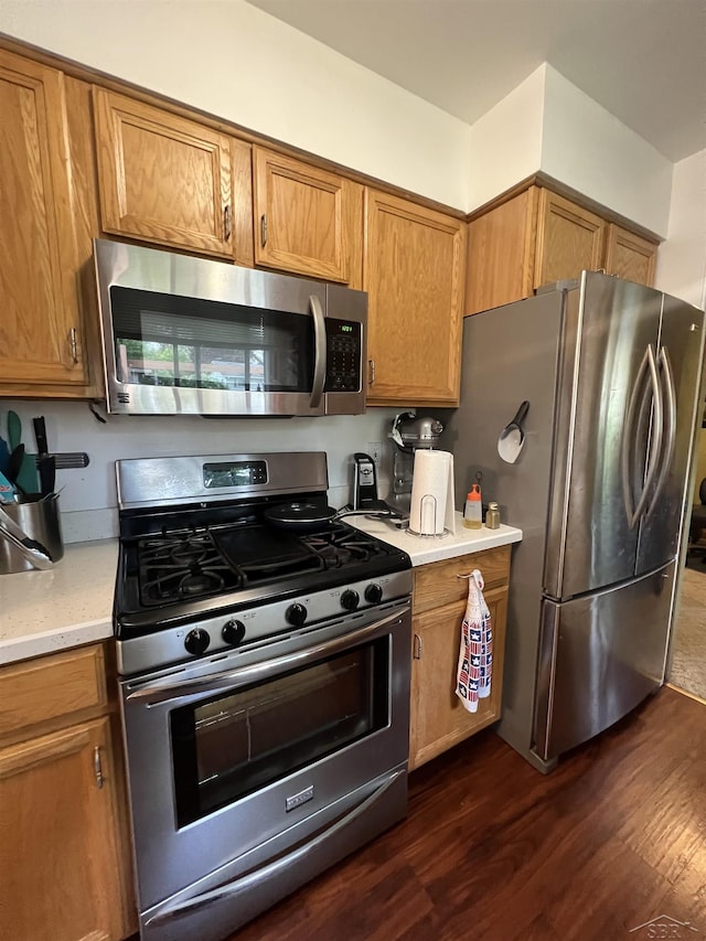 1441 Dover Pl, Saginaw, MI 48638 - kitchen with stainless steel appliances, brown cabinets, and dark wood-type flooring