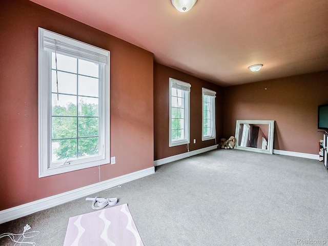 4575 Forest Edge Ln, West Bloomfield, MI 48323 - unfurnished living room with carpet floors and baseboards