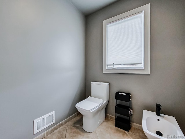 4575 Forest Edge Ln, West Bloomfield, MI 48323 - half bath with a bidet, toilet, tile patterned flooring, and baseboards