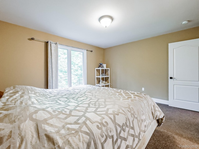 4575 Forest Edge Ln, West Bloomfield, MI 48323 - bedroom featuring dark colored carpet and baseboards