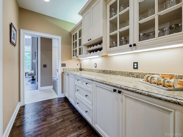 4575 Forest Edge Ln, West Bloomfield, MI 48323 - bar area with dark wood-style floors, baseboards, and a sink