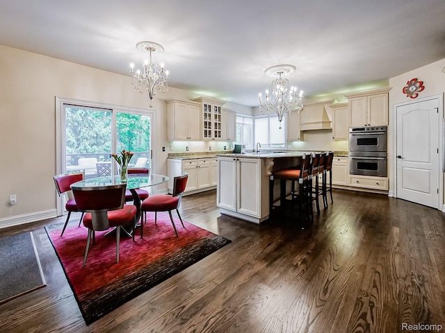 4575 Forest Edge Ln, West Bloomfield, MI 48323 - dining area with a chandelier, dark wood finished floors, and baseboards