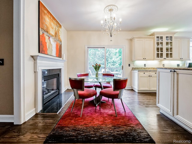 4575 Forest Edge Ln, West Bloomfield, MI 48323 - dining space featuring a chandelier, dark wood-style flooring, baseboards, and a fireplace