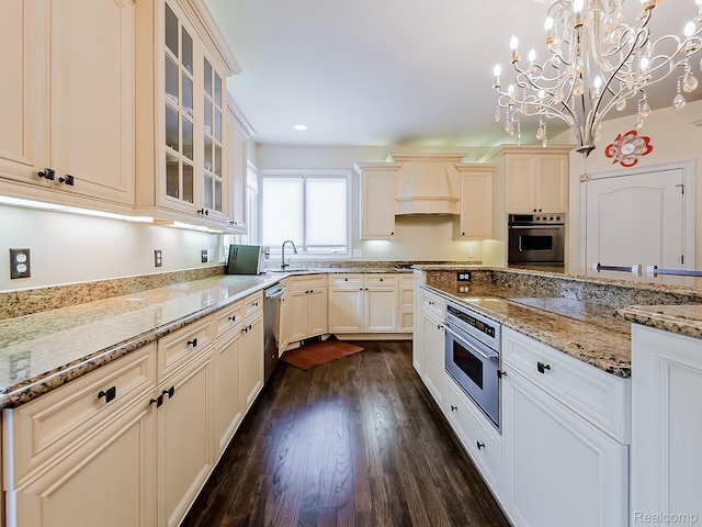 4575 Forest Edge Ln, West Bloomfield, MI 48323 - kitchen with custom range hood, stainless steel appliances, a sink, dark wood-type flooring, and light stone counters