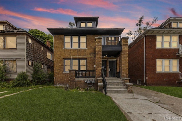 12242 Washburn St, Detroit, MI 48204 - traditional style home featuring a balcony, a front lawn, and brick siding