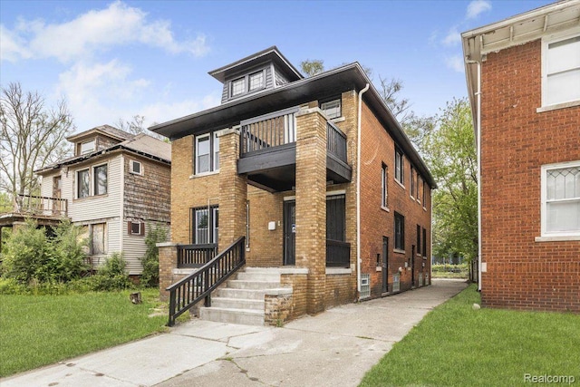 12242 Washburn St, Detroit, MI 48204 - traditional style home featuring a balcony, a front yard, and brick siding