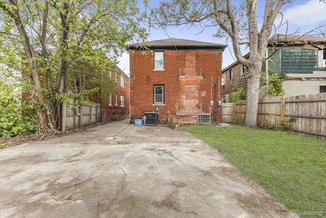 12242 Washburn St, Detroit, MI 48204 - back of house featuring cooling unit and brick siding