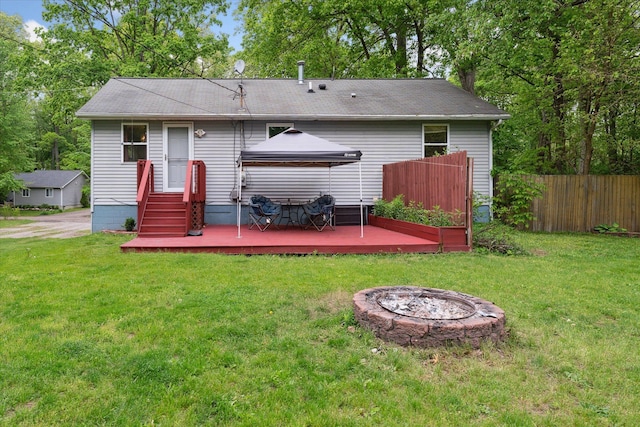 6544 Woodland Rd, Whitmore Lake, MI 48189 - rear view of property featuring an outdoor fire pit, a gazebo, and a deck
