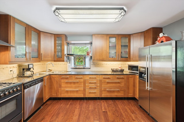 6544 Woodland Rd, Whitmore Lake, MI 48189 - kitchen featuring appliances with stainless steel finishes, a sink, dark wood finished floors, and tasteful backsplash