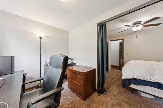 6544 Woodland Rd, Whitmore Lake, MI 48189 - carpeted bedroom featuring a desk and ceiling fan