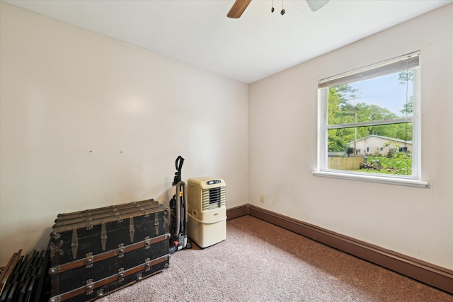 6544 Woodland Rd, Whitmore Lake, MI 48189 - misc room featuring baseboard heating, carpet flooring, and ceiling fan