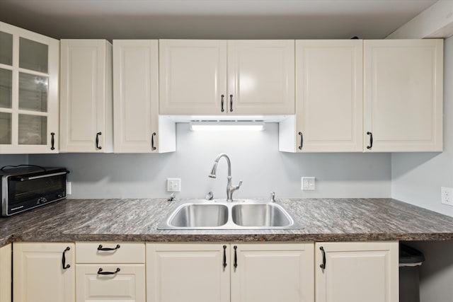 6544 Woodland Rd, Whitmore Lake, MI 48189 - kitchen with a sink, white cabinetry, and glass insert cabinets