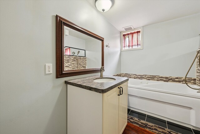 6544 Woodland Rd, Whitmore Lake, MI 48189 - full bathroom featuring vanity and a bathtub