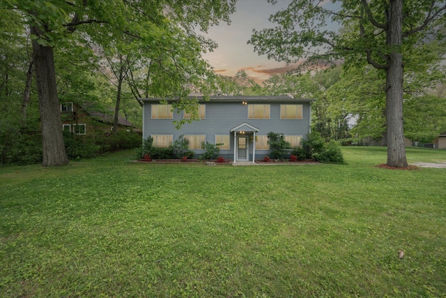 6544 Woodland Rd, Whitmore Lake, MI 48189 - colonial inspired home featuring a lawn